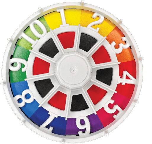 A colorful circular game spinner with numbered sections from one to ten in a gradient of colors from green to yellow, orange, red, pink, purple, and blue, with a white plastic frame and a central pivot. Description generated by AI